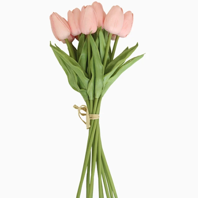 Pink artificial tulip bouquet with green leaves