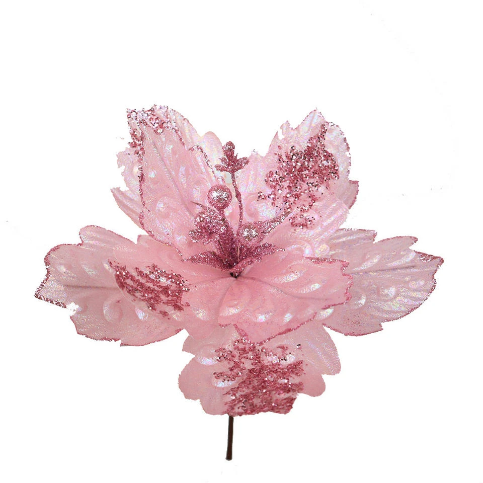 Pink artificial decorative flower with glittering details on a short stem
