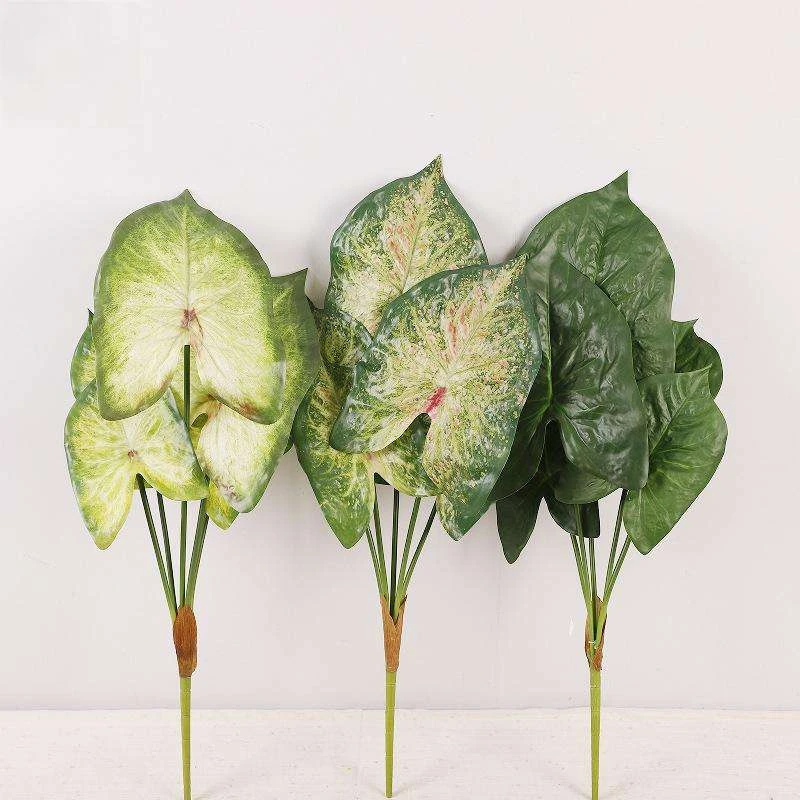 Three artificial broad-leaf sprays shown in pale green, mottled green and dark green