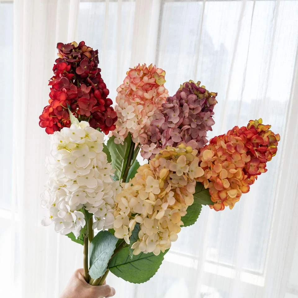 Artificial hydrangea stems with elongated red, pink, cream and orange flower clusters